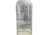 a glass case with a clock inside of it