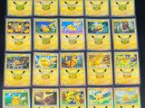 a close up of a collection of pokemon cards on a table