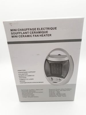 boîte contenant un mini-radiateur, avec le mode d'emploi à l'intérieur