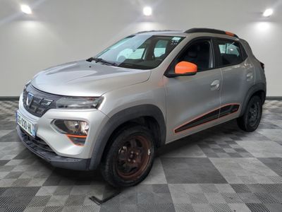 a silver and orange car parked in a garage