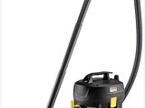 un aspirateur noir et jaune muni d'une poignée jaune