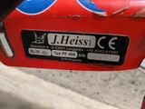 a close up of a red motorcycle with a sticker on it