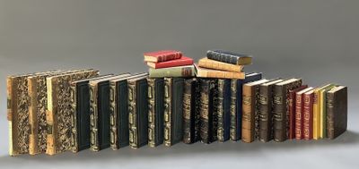 many books stacked on top of each other on a table