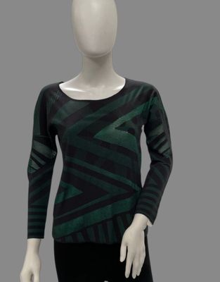 the mannequin is wearing a green and black top