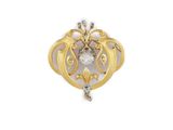 a close up of a gold and diamond broochle on a white background