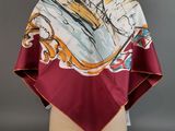 a red and white scarf with a picture of a ship on it