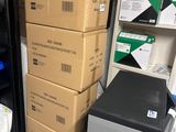 many boxes stacked on top of each other in a room