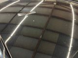 a close up of a parking meter on the roof of a car