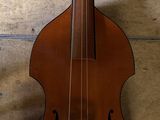 a violin hanging on the wall next to a wall