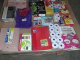 a table full of school supplies and supplies on the floor