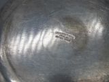 a close up of a metal bowl with a label on it