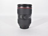 a camera lens sitting on a white surface