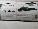 a roll of paper that has a green umbrella on it