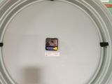 a white plate with a picture on it sitting on a table