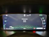 the dashboard of a car with a digital display on it