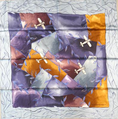 purple, orange, and yellow silk scarf with airplanes on it
