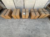 several cardboard boxes are lined up on the floor in front of a wall