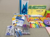 a lot of school supplies on the table