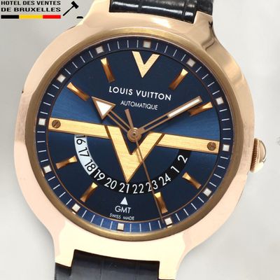 a watch that has a blue dial on it