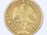 l'image d'une pièce d'or ornée d'un aigle