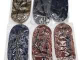 six pairs of slippers are wrapped in plastic bags on a white surface