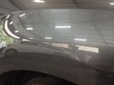 a reflection of a car in a mirror on the side of a car