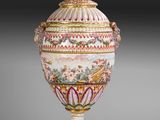 an image of a large vase with a lid on a stand