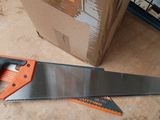a pair of saws sitting on a table next to a cardboard box