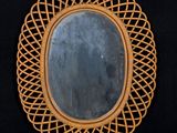 a mirror that is sitting on a black surface