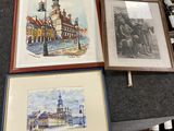 three framed pictures of buildings and a clock on a table