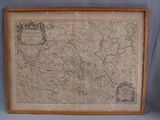an old map of germany in a wooden frame on a blue background