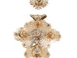 two pieces of gold colored brooches and a pair of earrings