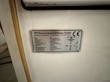 a sign on the door of a white refrigerator