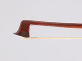 a close up of a violin bow on a white background