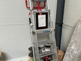 a ladder that is next to a pile of wires
