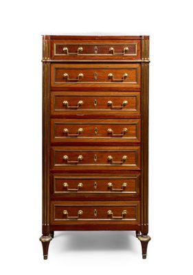 a wooden chest of drawers with a marble top