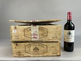 two wooden boxes of wine with a bottle of wine in front of them