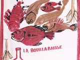 a picture of a dish towel with a picture of a fish and a bottle of wine on it