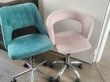 two chairs sitting next to each other in a room
