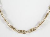 a close up of a gold chain necklace on a white background