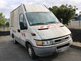 a white van that is parked on the side of the road