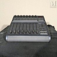 an image of a sound board sitting on top of a black bag