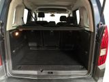 the back of a van with the trunk open and the seats down