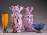 three vases sitting next to each other on a table