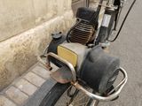a motorcycle that is parked on the side of the street
