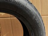 a close up of a tire on a cardboard box with a cardboard box in the background