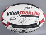 an image of a soccer ball with autographs on it