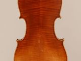 an old violin with a wooden back and a long neck