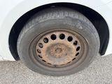 a white car that has a flat tire on it