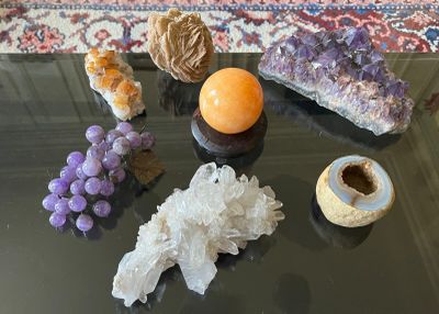 many different types of crystals on the table